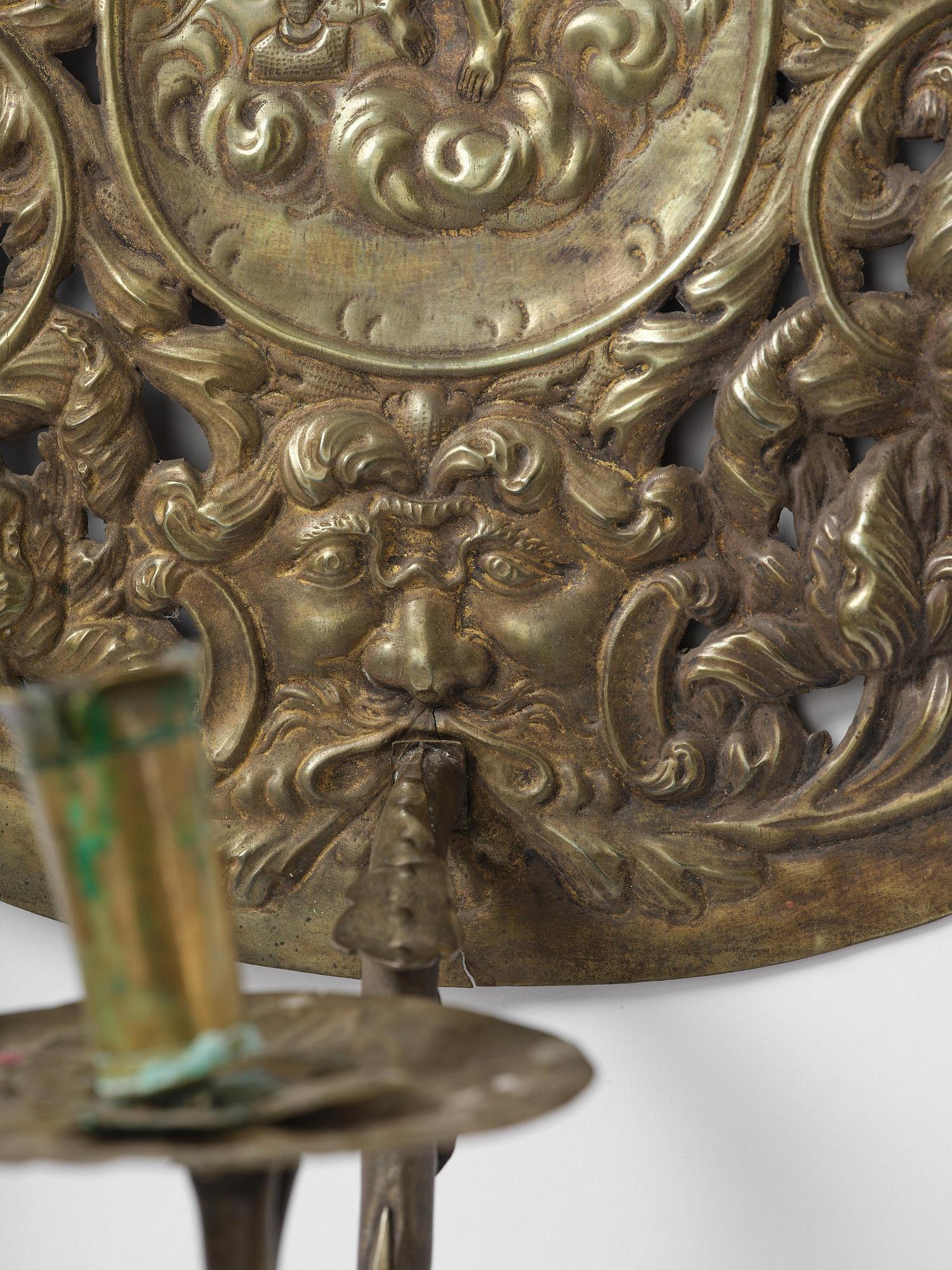 A set of four Swedish Baroque repoussé silvered brass reflector one-branch reflector plates, ca 1690-1700.