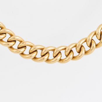 18K gold curb link necklace.