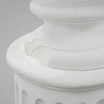 A plaster bust and pedestal.