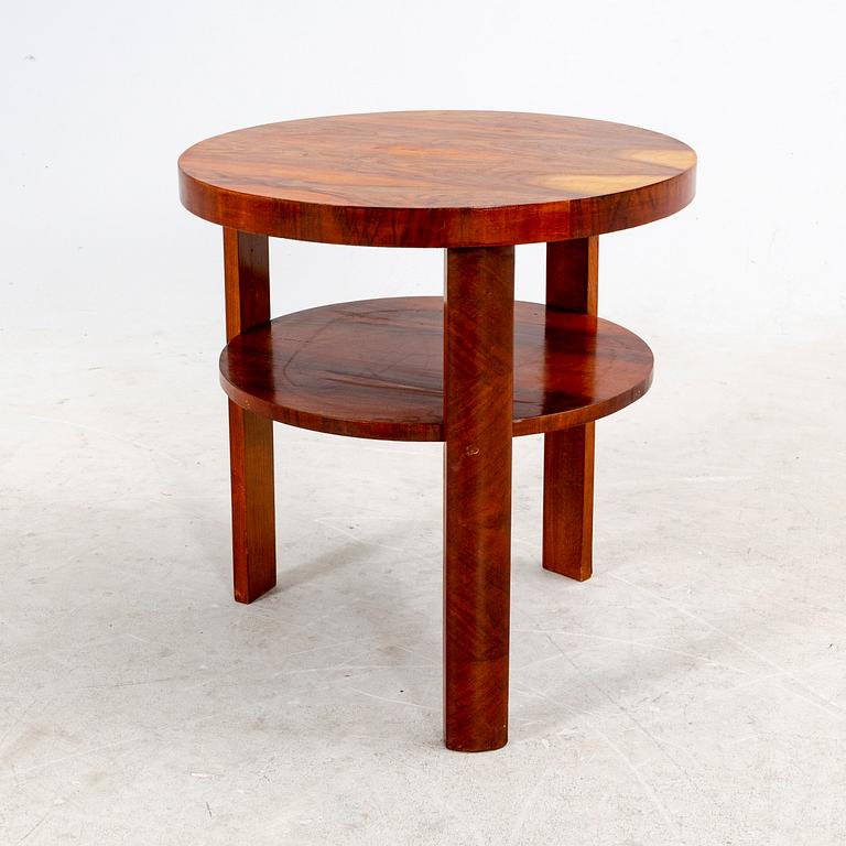 A veneered table from the first half of the 20th century.