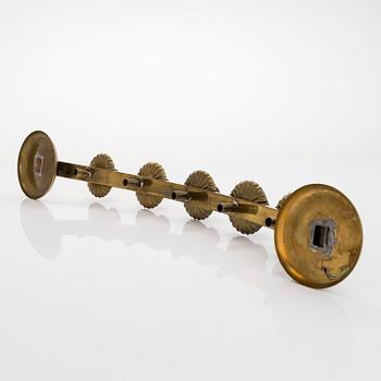 A mid-20th century brass candle holder, Idman.