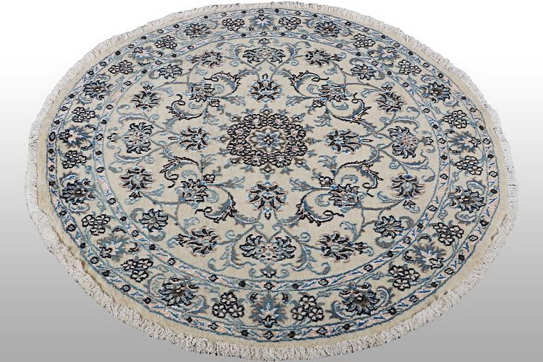 A rug, Nain, part silk, ca 136 x 136 cm.