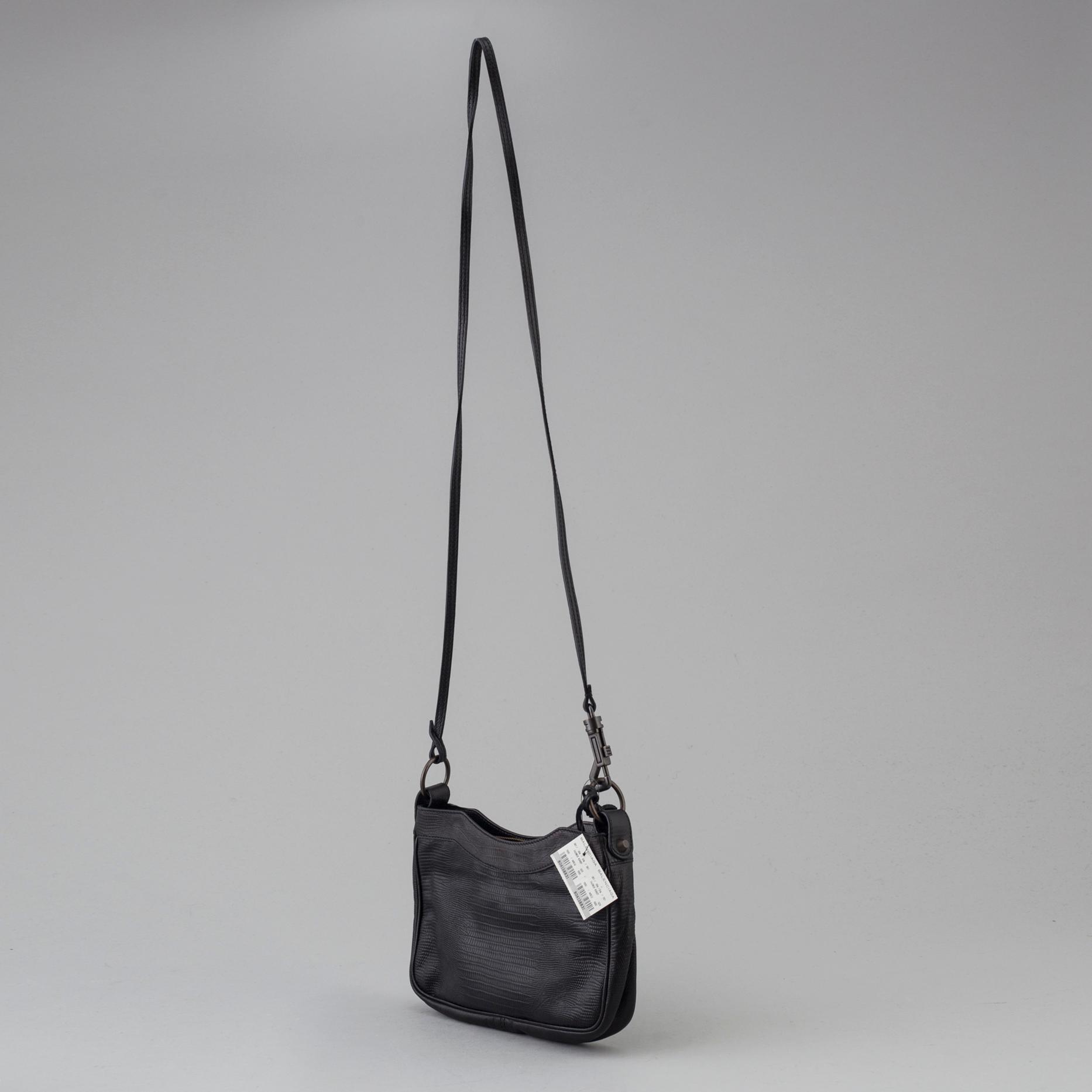 A black alligator printed leather "Classic hip" bag by Balenciaga.