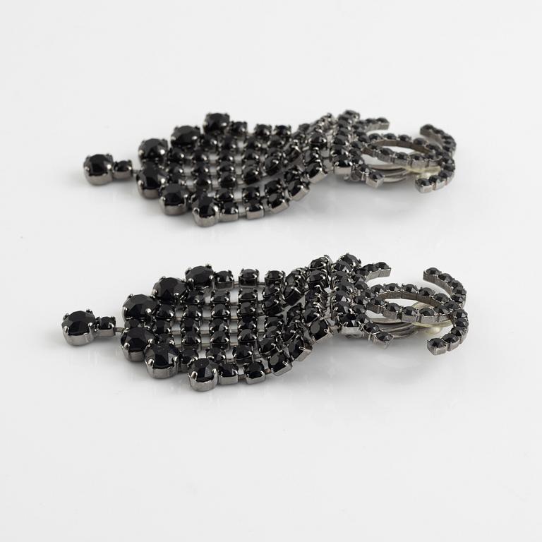 Chanel, a pair of silvermetal and rhinestone earrings, 2018.