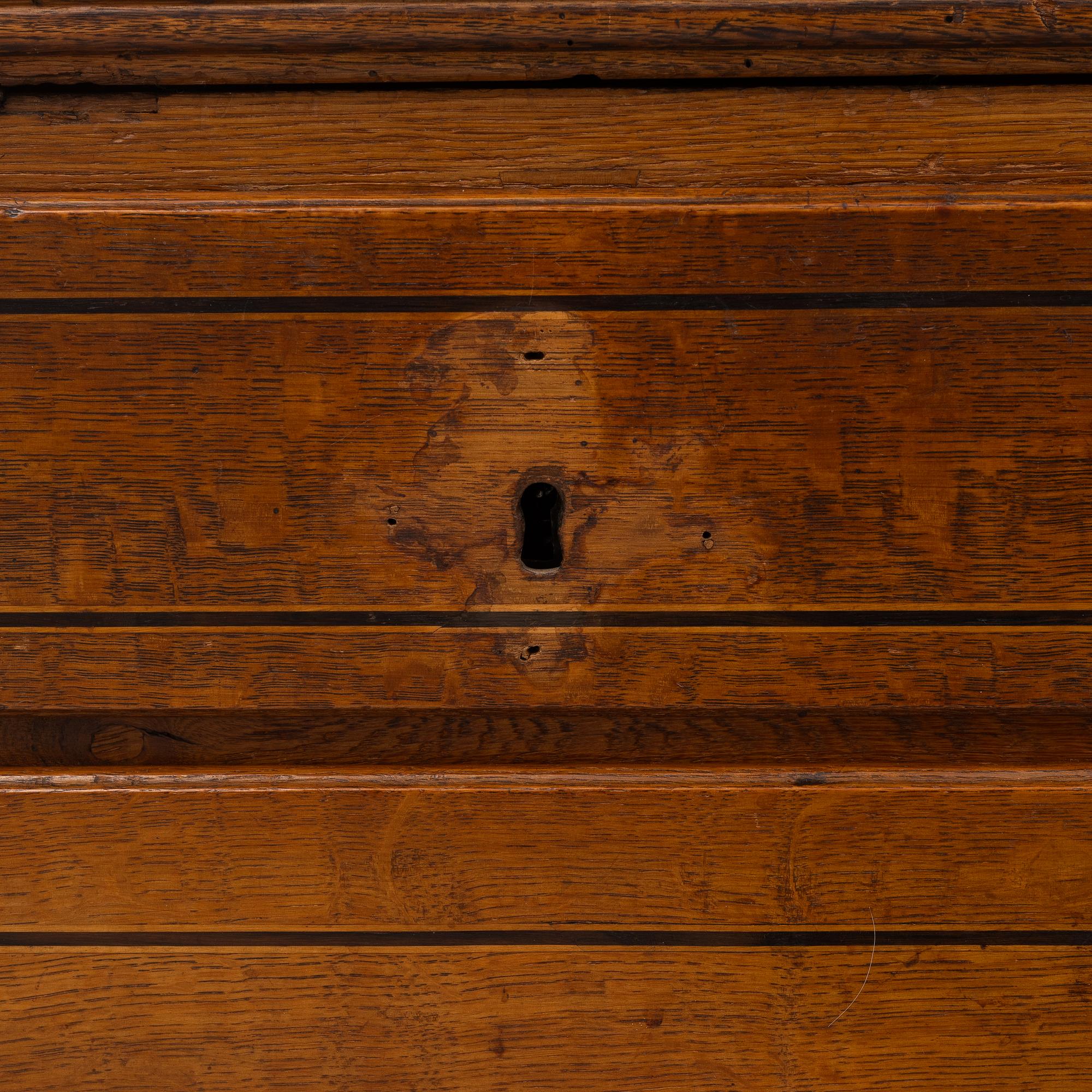 An oak secretaire, first half of the 19th century.