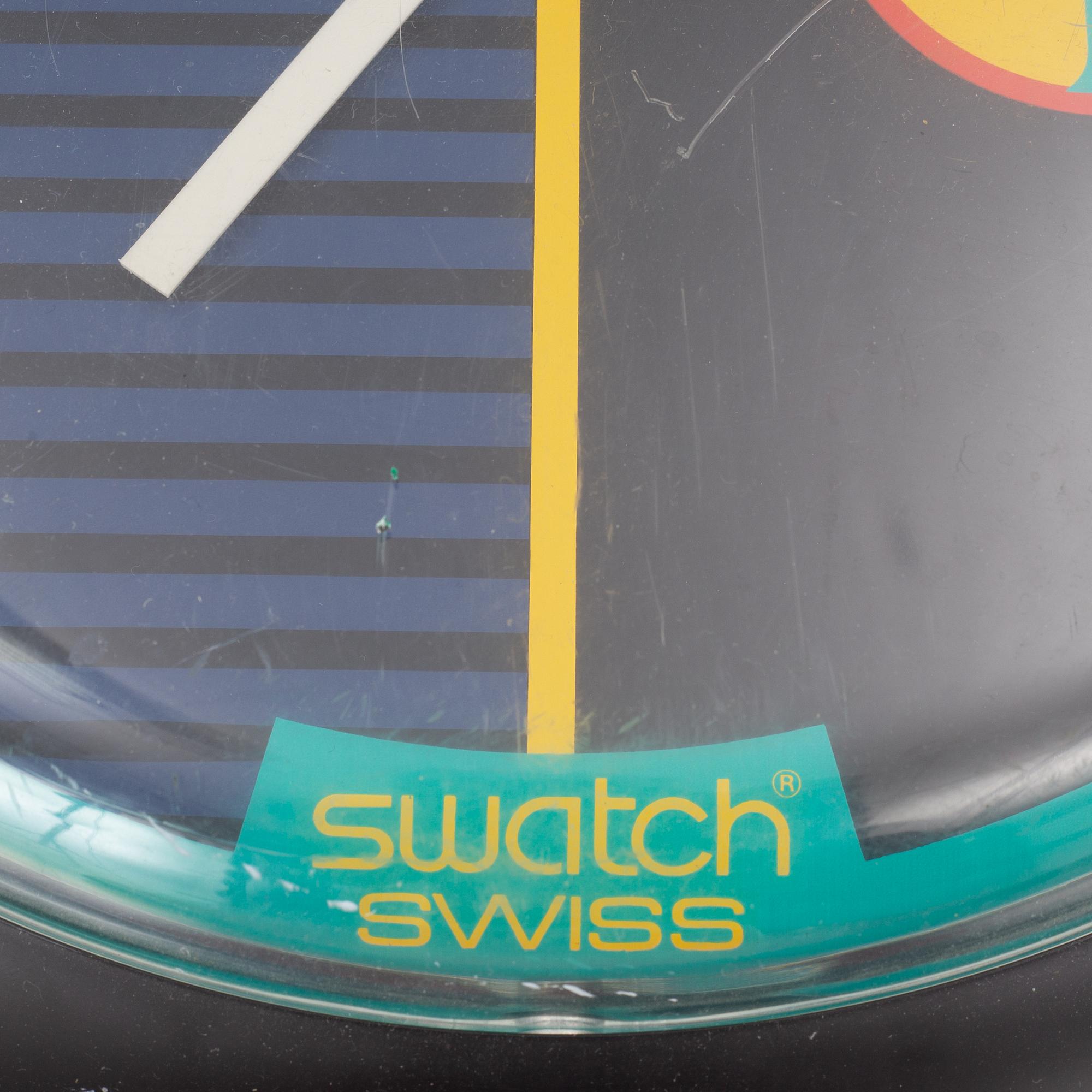 Wall clock, Swatch.