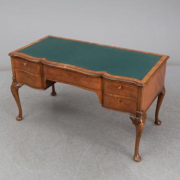 A Rococo-style circa 1900 writing desk.