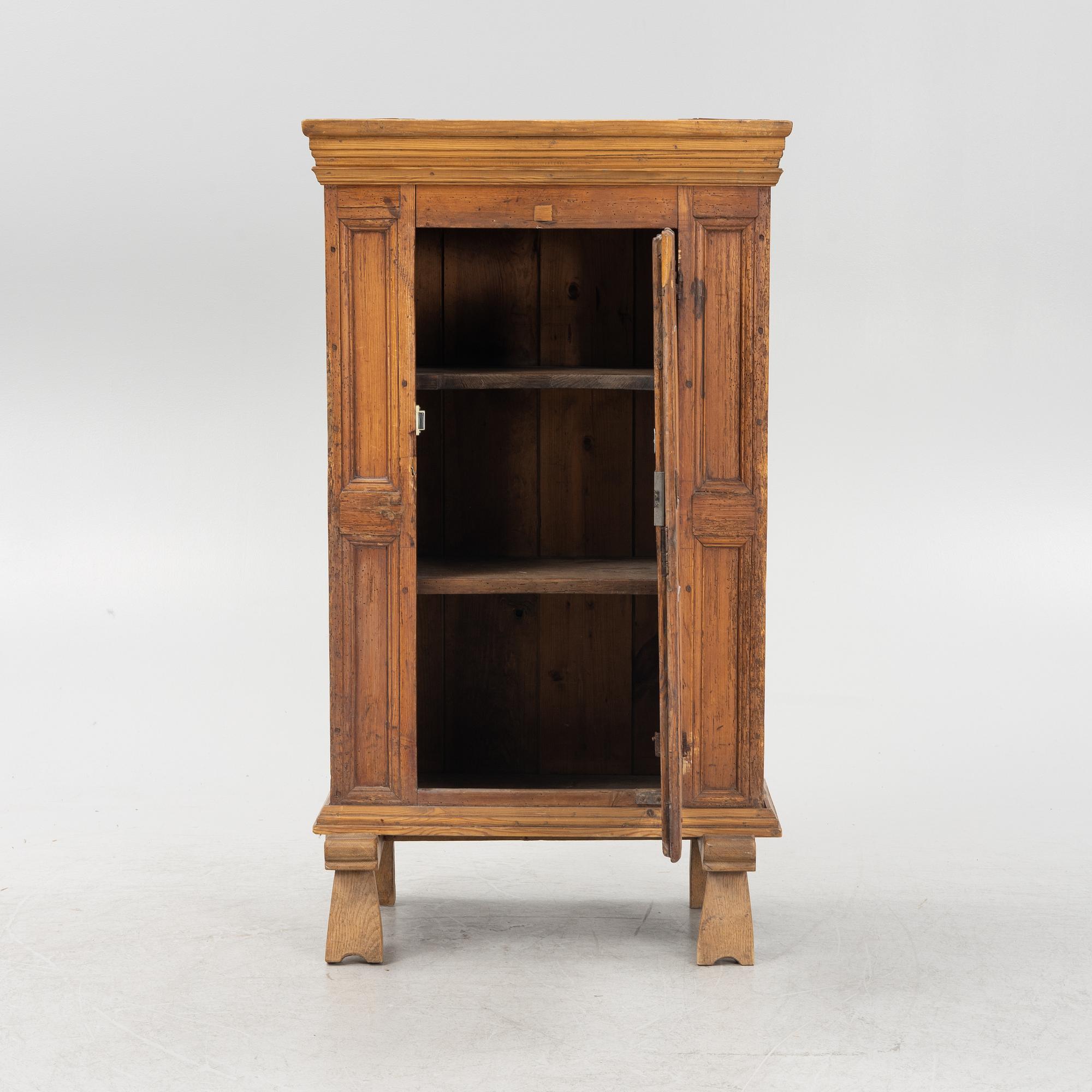 A pinewood cabinet, 18th Century.