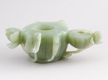 A Chinese lotusshaped serpentine stone brush washer.