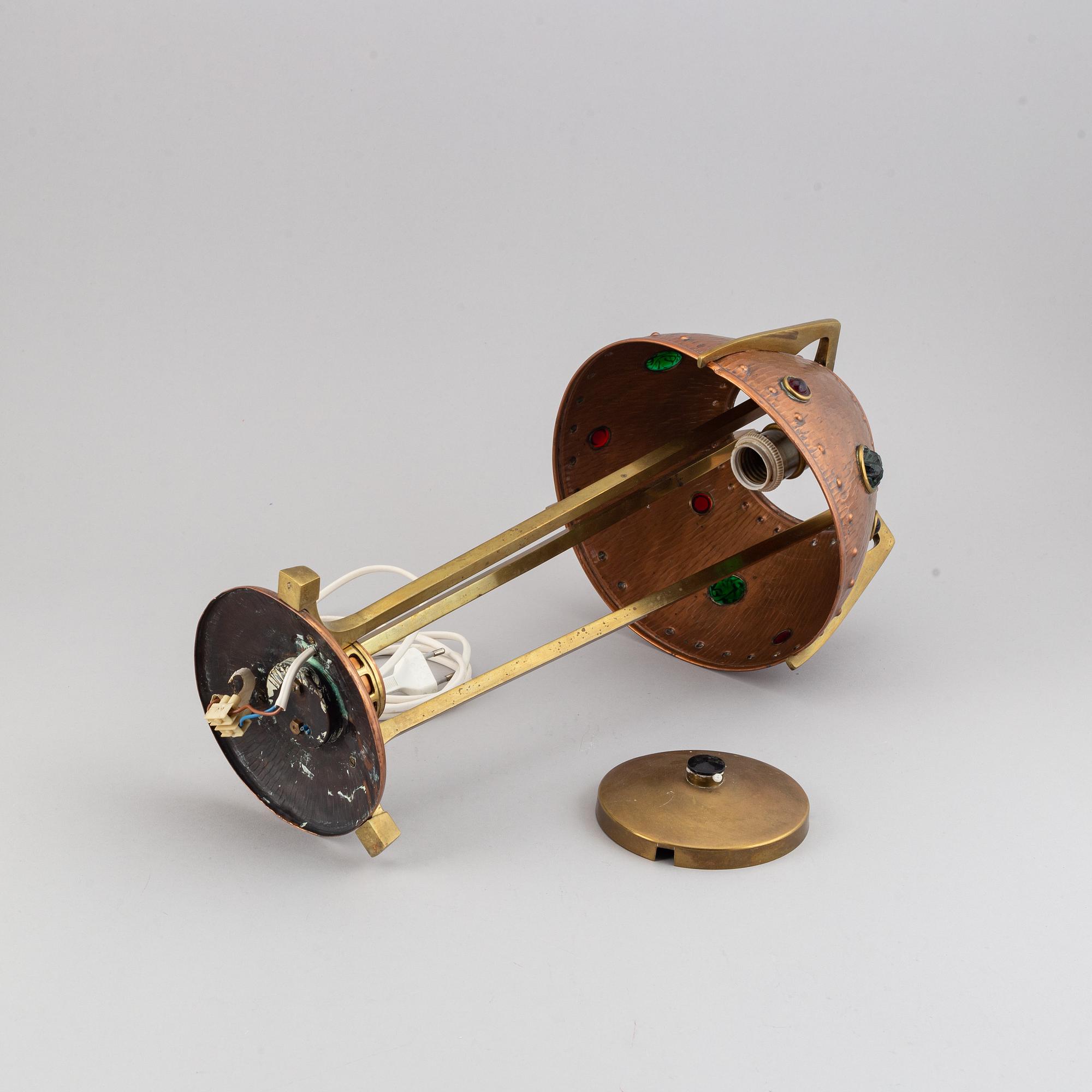 An early 20th century, brass and copper table lamp.