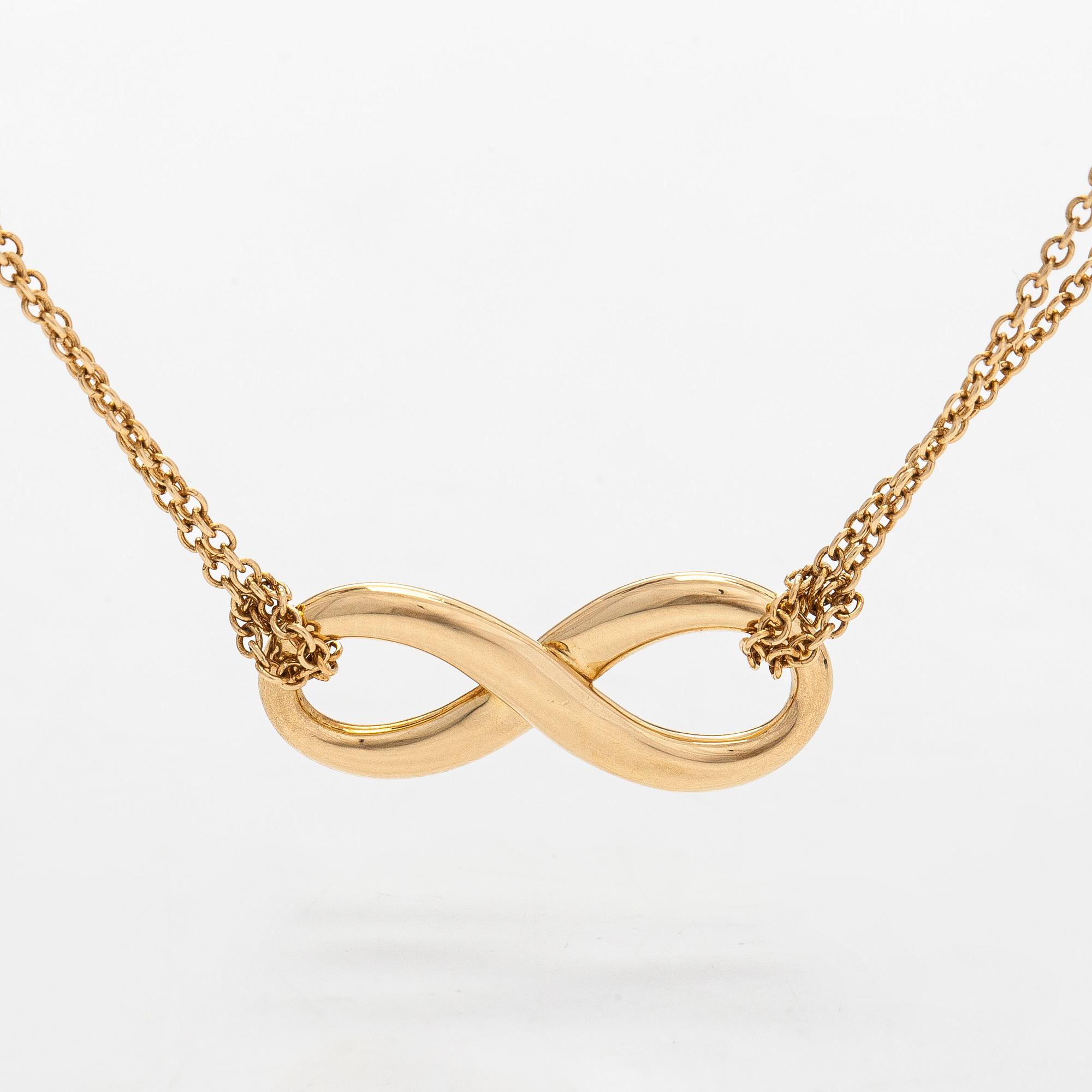 Tiffany & Co, an 18K gold 'Infinity' necklace.