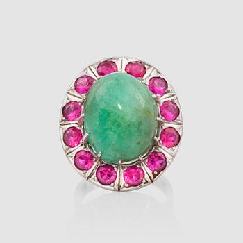 A cabochon-cut nephrite and pink sapphire ring.