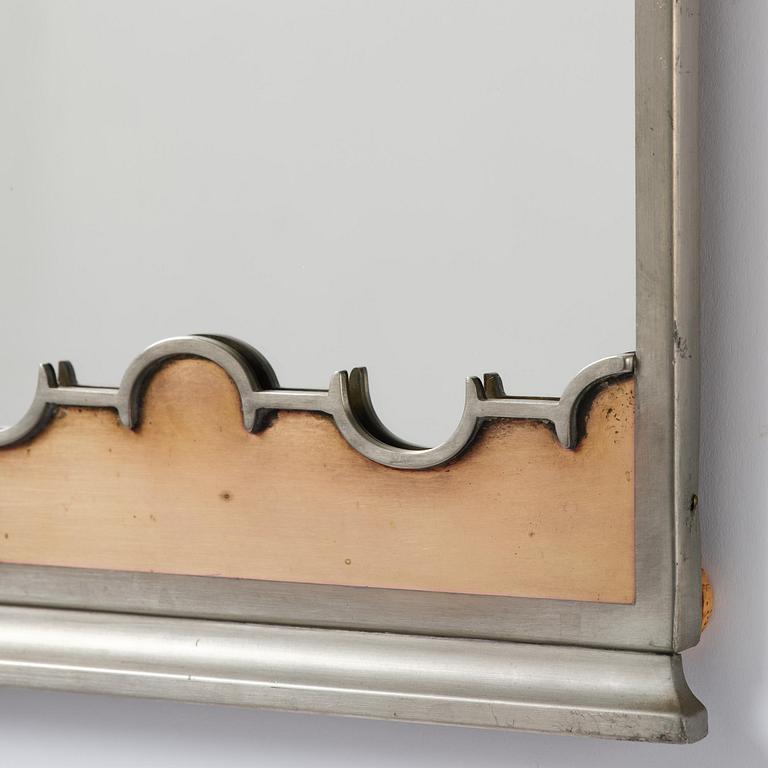 Nils Fougstedt, a rare pewter and brass wall mirror model A 679, Firma Svenskt Tenn, Stockholm, 1932.