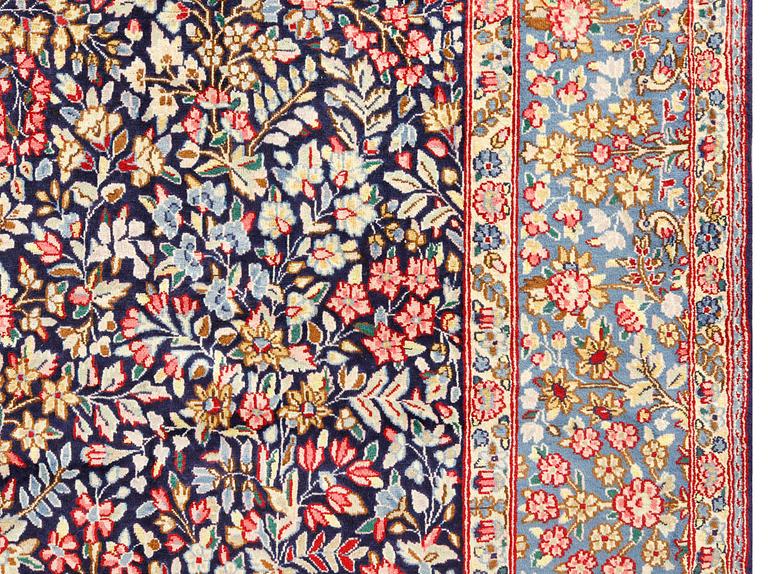 A pictoral 'Millefleur' Kerman carpet, c 340 x 240 cm.
