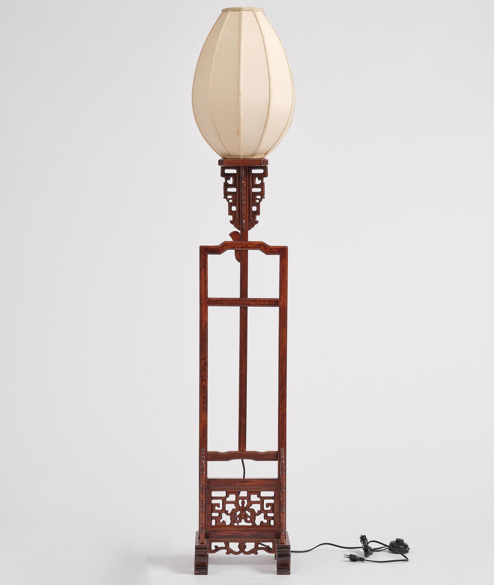 A Chinese wooden floor lamp, later part of the 20th century.