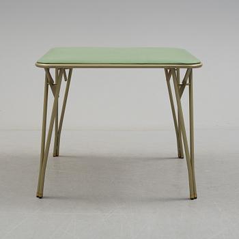 A table and four chairs by Dipetrol, second half of the 20th century.