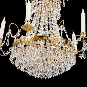 A 1980s Empire style chandelier. Height ca 50 cm.