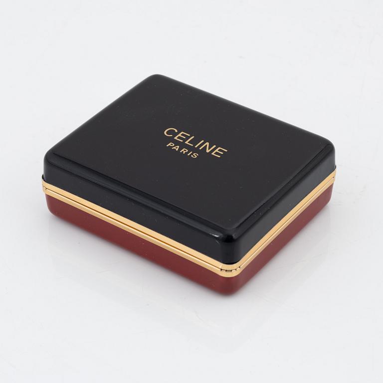 Céline, a pair of gold tone and rhinestone clip-on earrings.