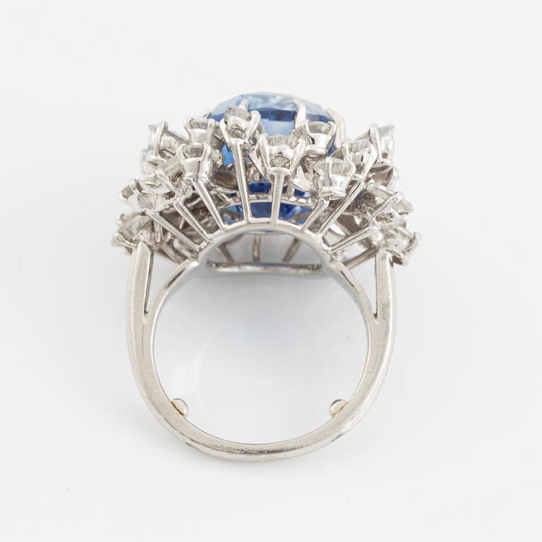 A platinum ring set with a faceted sapphire.