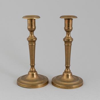 A PAIR OF BRONZE CANDLESSTICKS, 19th century.