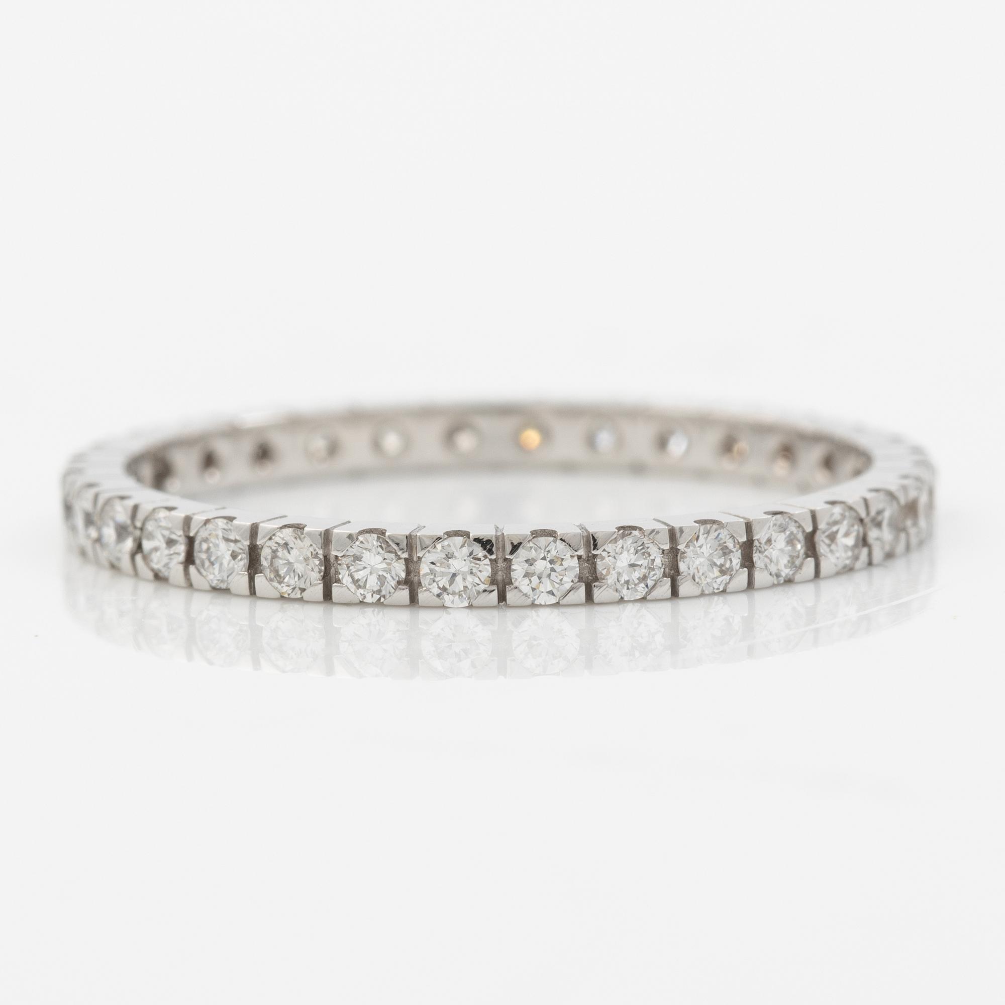 Ring, full eternity, 18K white gold with brilliant-cut diamonds.