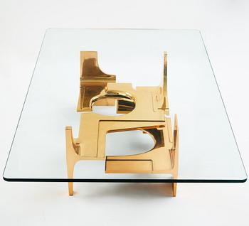 Gerard Mannoni, a polished bronze and glass sofa table, France 1974.