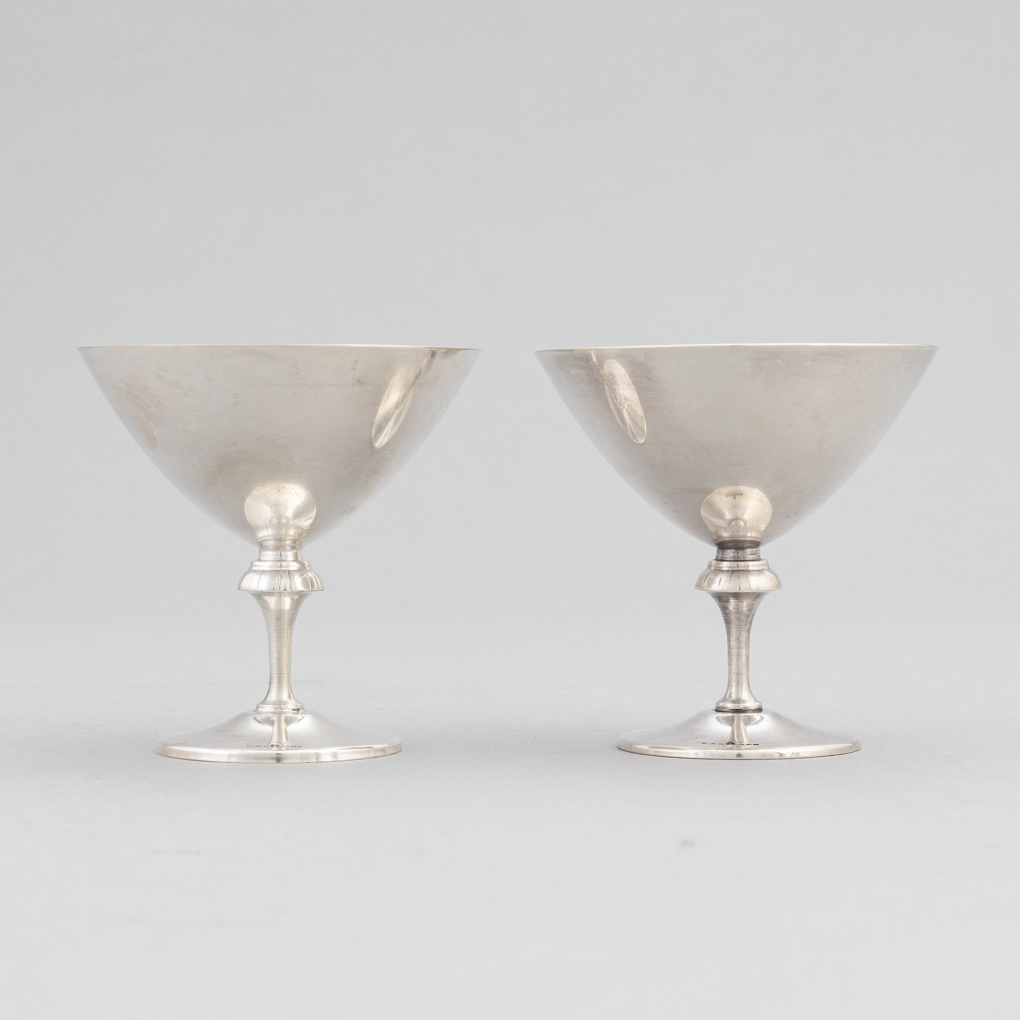 A silver plated shaker, C.G. Hallberg and a set of twelwe cocktail glasses, GAB, second half of the 20th Century.