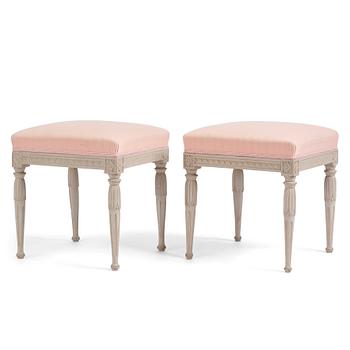 91. A pair of carved Gustavian stools by E. Öhrmark (master in Stockholm 1777-1813).