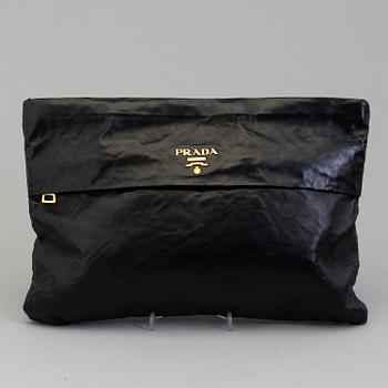 A black leather bag/clutch by Prada.