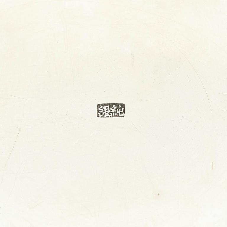 A Chinese double walled 'dragon' silver bowl, Shanghai, around 1900.