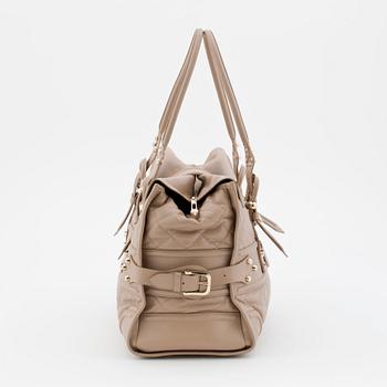BURBERRY, a beige leather weekend bag.