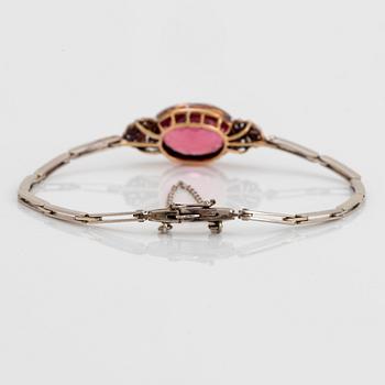 An 18K gold bracelet set with a faceted pink tourmaline weight ca 6.00 cts.