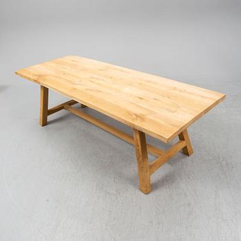 A contemporary oak table and two benches from Garbo Interiors.