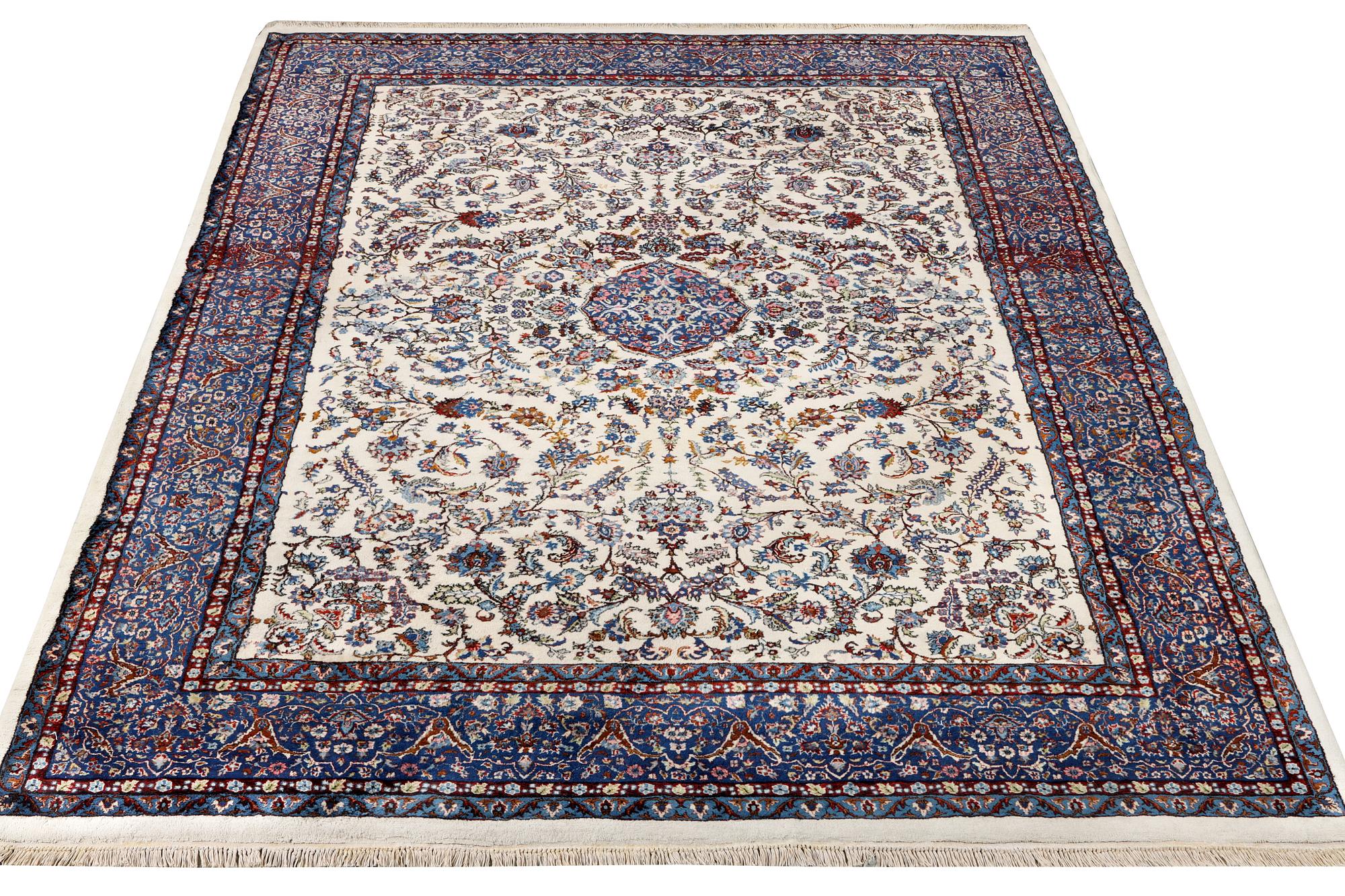 An oriental carpet with a Kerman pattern, c. 308 x 220 cm.