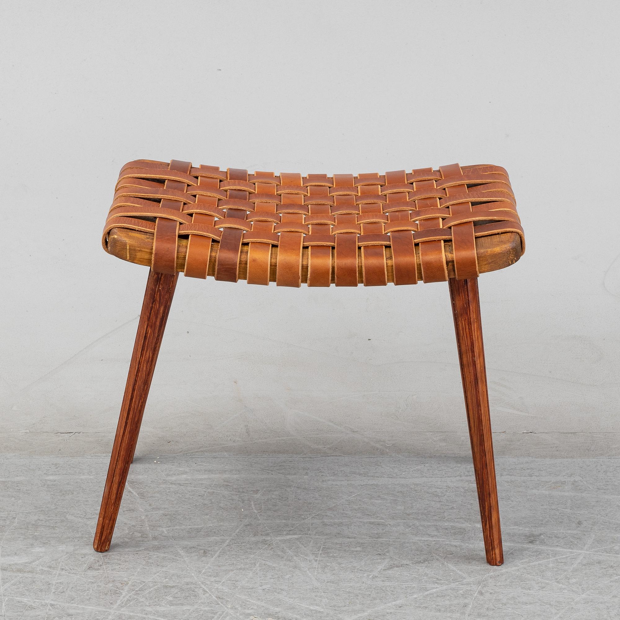 A leather upholstered stool, 1950's.