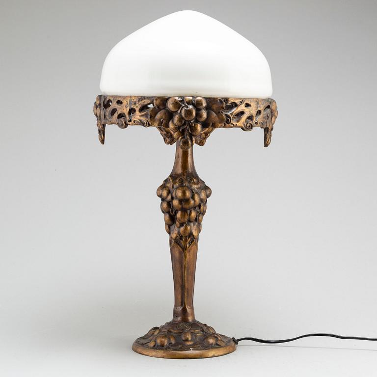 An early 20th Century art noveau bronze table lamp.