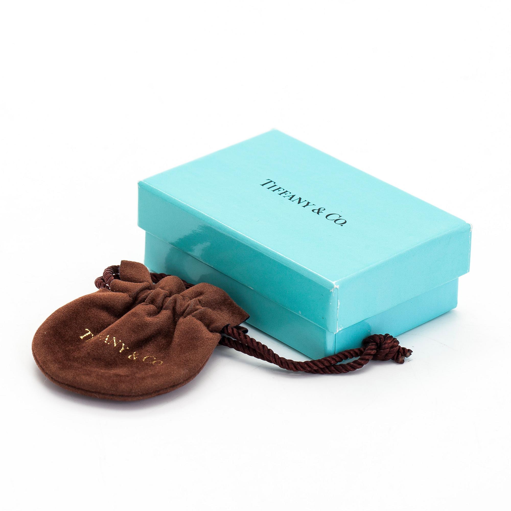 Tiffany & Co, Paloma Picasso, "Double Loving Heart" kaulakoru, 18K valkokultaa ja briljanttihiottuja timantteja.