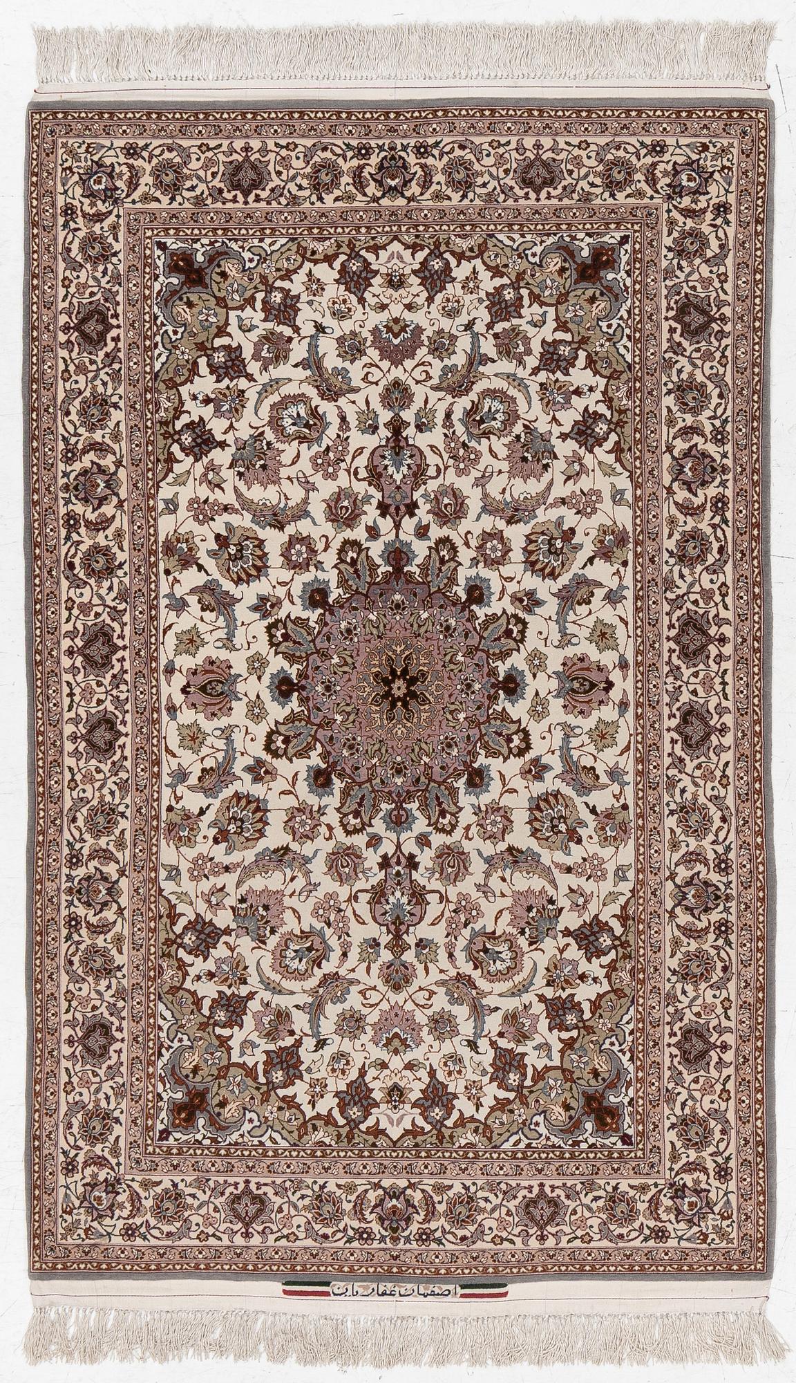 A semi-antique Isfahan rug, central Persia, signed Ghaffarian, c. 180 x 112 cm.