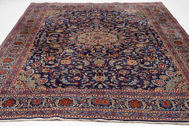 An oriental carpet, c. 390 x 295 cm.