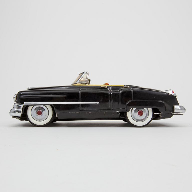 A Nomura Toys Cadillac Japan 1950s.