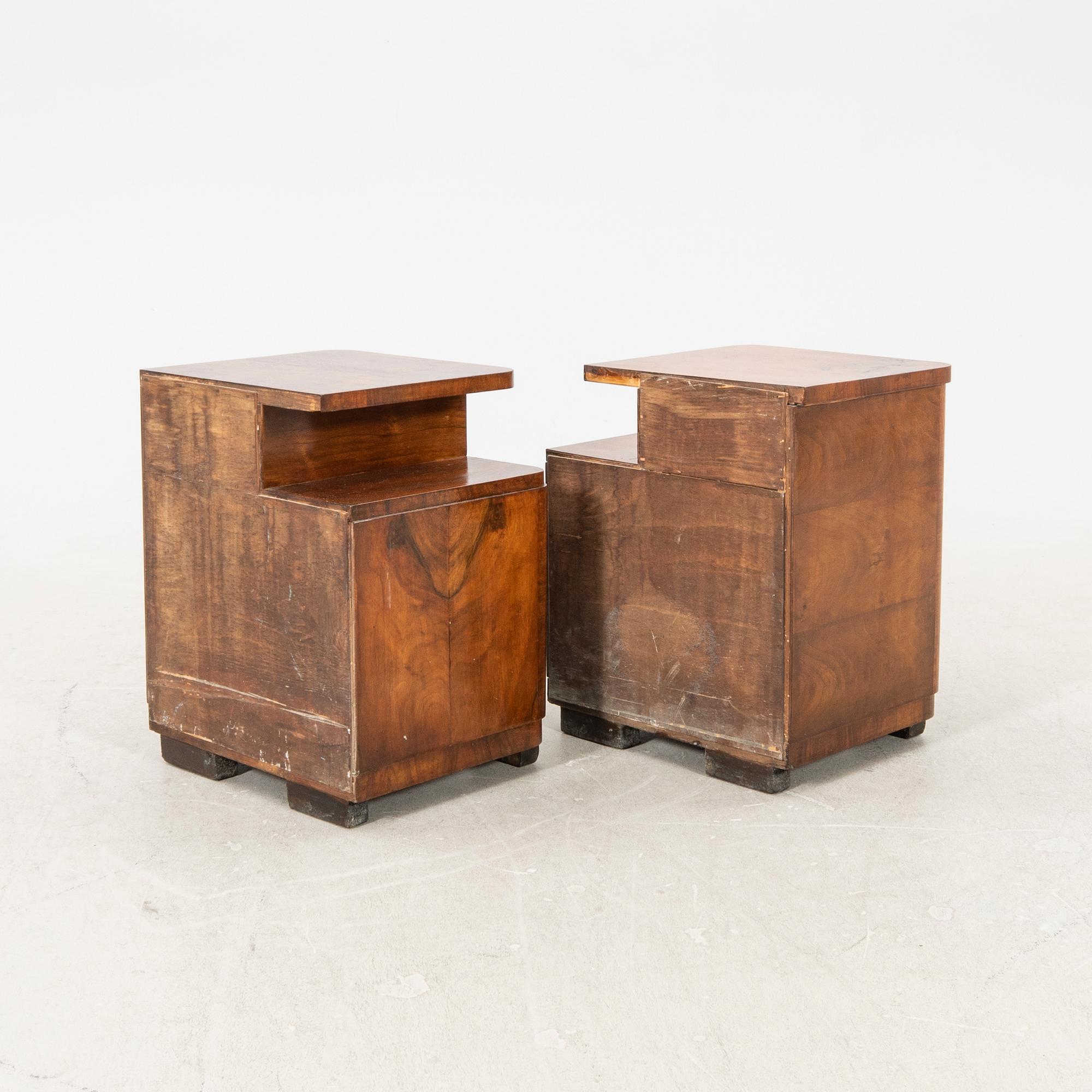 A pair of Art deco walnut bedside tables.