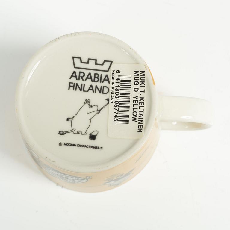 Muminmugg, "Mörk gul" med etikett, Arabia, Finland, 1991-99.
