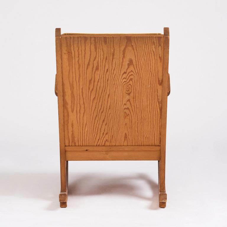 Nordiska Kompaniet, a Swedish Modern stained pine 'Lovö' rocking chair.