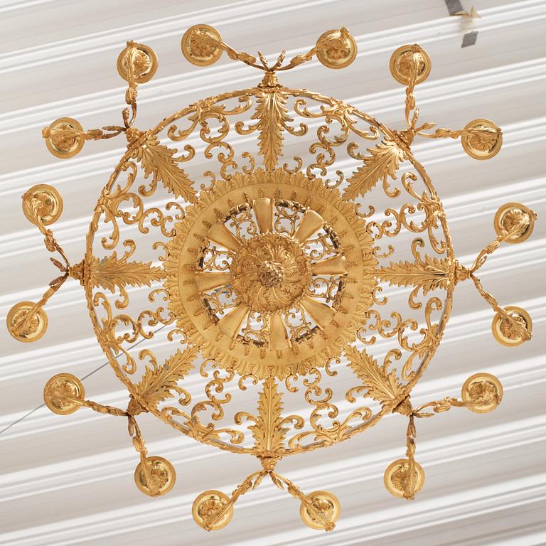 A rococo-revival gilt-brass sixteen-light chandelier, mid 19th century.
