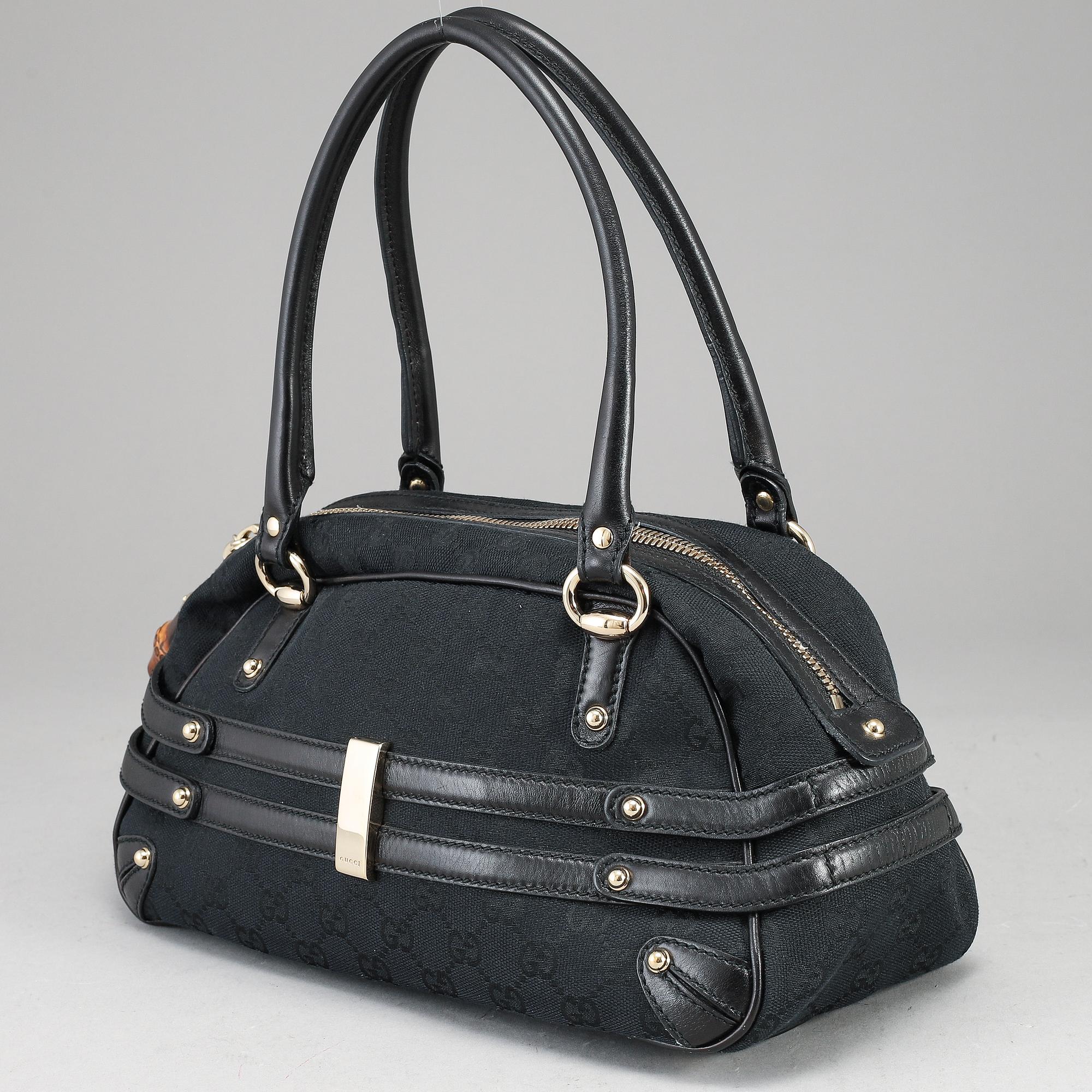 GUCCI, 'GG Canvas Horsebit Wave Handbag'.