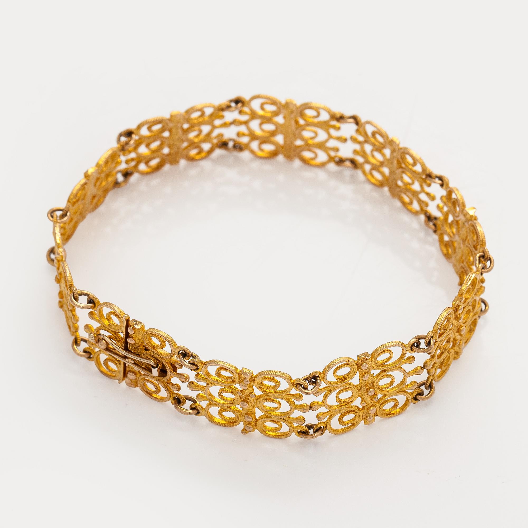 Esko Raitanen, collier, armband och örhängen, 14K guld, Helsingfors 1972.