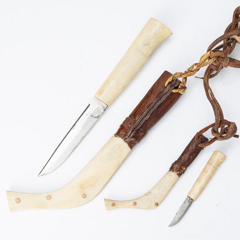 Half-horn knives, cup, bottle, needle case.