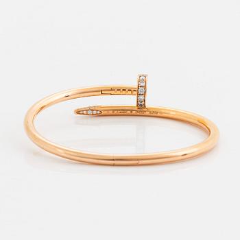 A Cartier "Juste en Clou" bracelet in 18K rose gold set with round brilliant-cut diamonds.