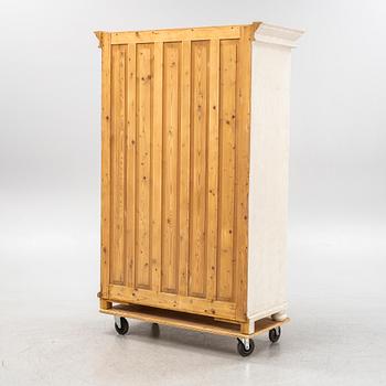 A painted clothes cabinet, 21st Century.