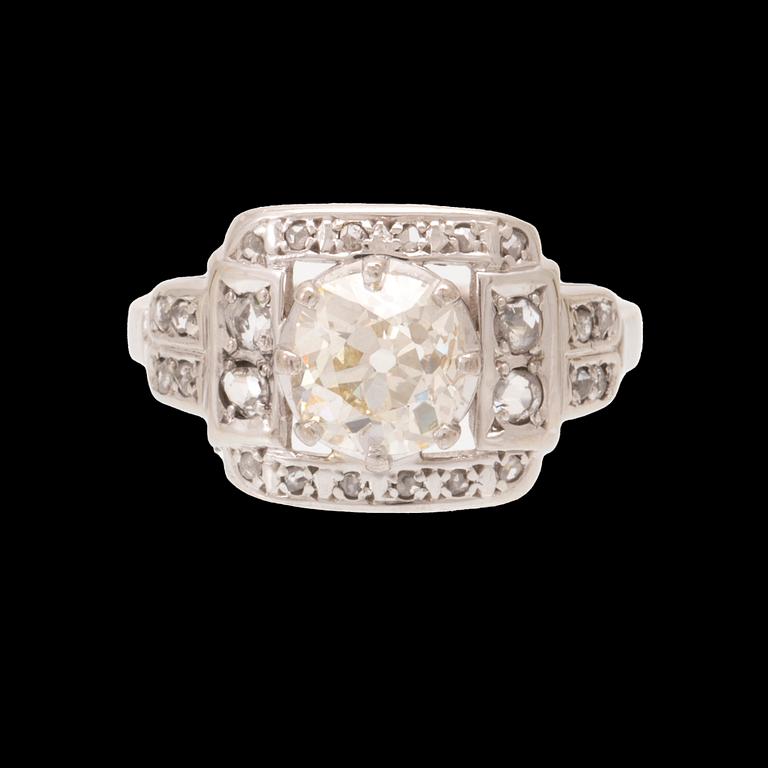 An 18K white gold ring set with an old cut diamond and rose cut diamonds.